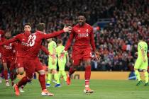 Liverpool's Divock Origi, center, celebrates scoring his side's fourth goal of the game during ...