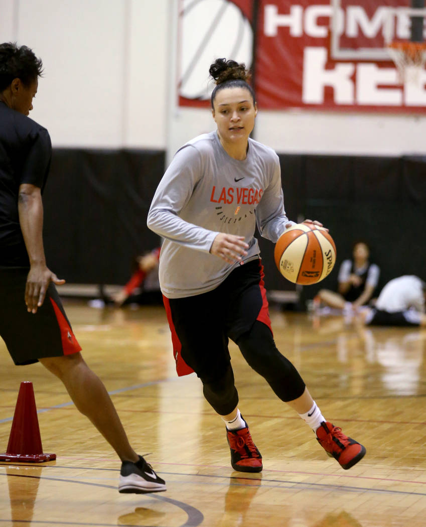 Las Vegas Aces guard Kayla McBride (21) runs a drill with Assistant Coach Vickie Johnson after ...