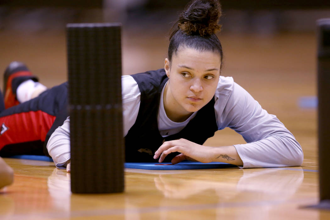 Las Vegas Aces guard Kayla McBride (21) stretches before practice at Cox Pavilion in Las Vegas ...