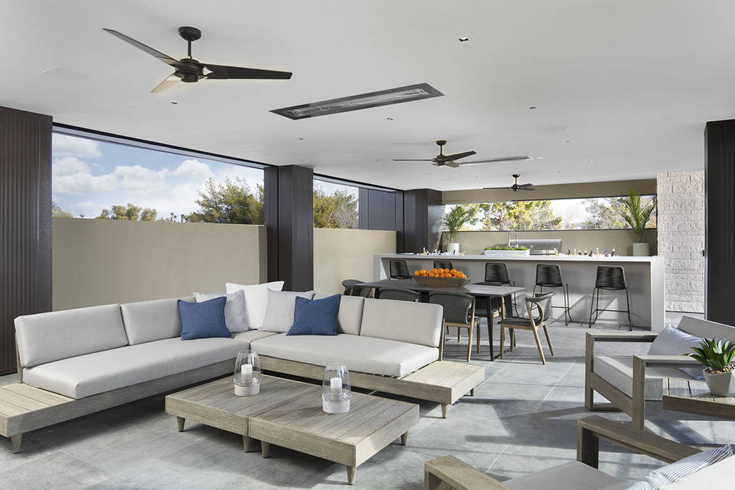 An outdoor kitchen is located upstairs and is connected to the master suite. (Studio G Architec ...