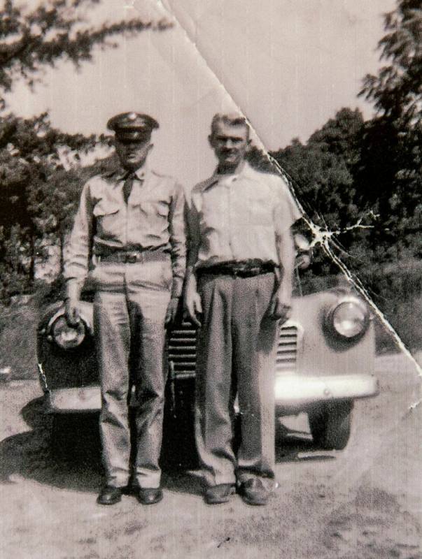 This undated photo provided by Clifford Smith shows his brother, Bill, left, and his father Phi ...