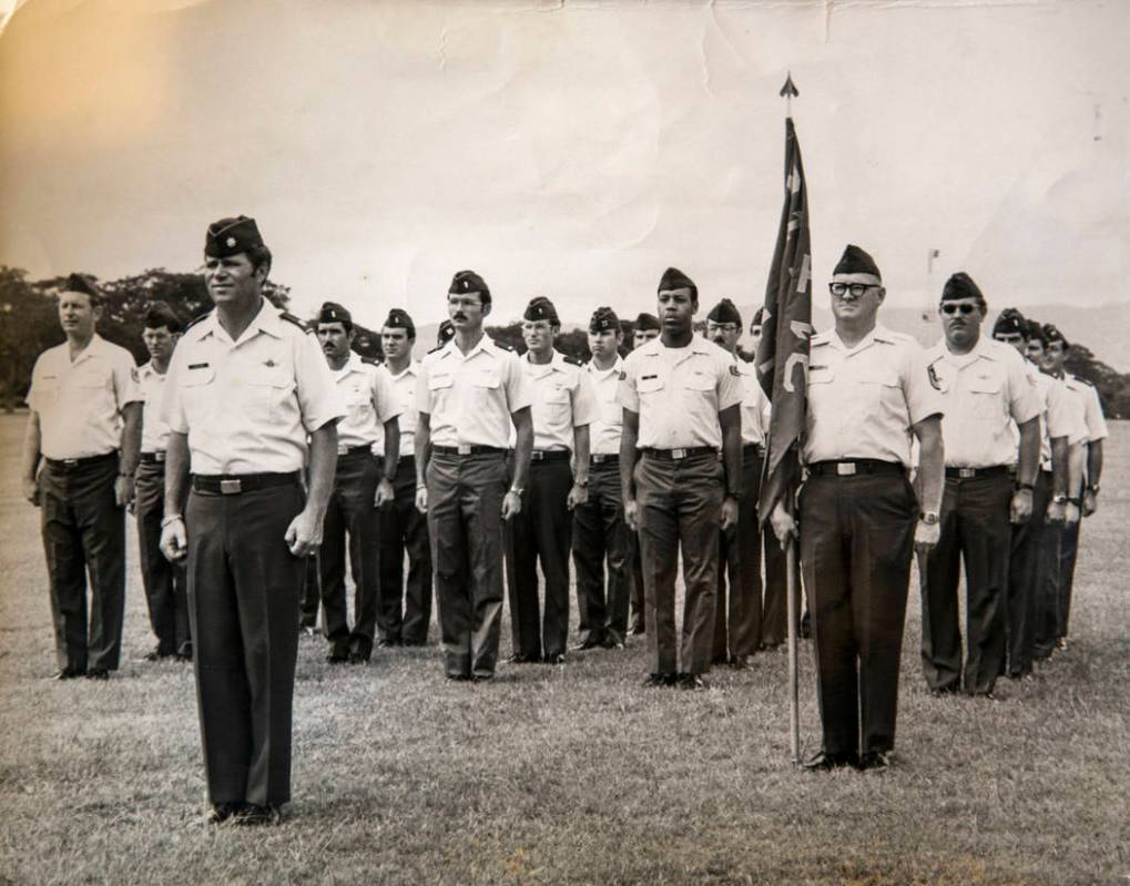 This 1983 photo shows Clifford Smith holding a flag during a Change of Command ceremony. The Sm ...