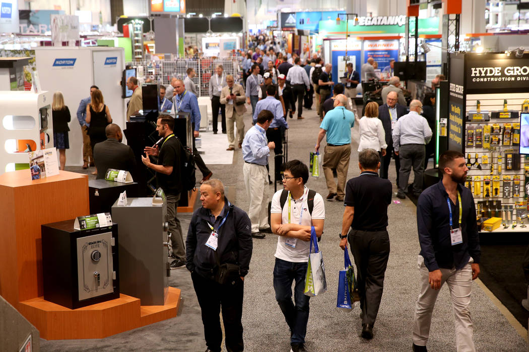 Conventioneers walk the show floor on opening day of the National Hardware Show at the Las Vega ...
