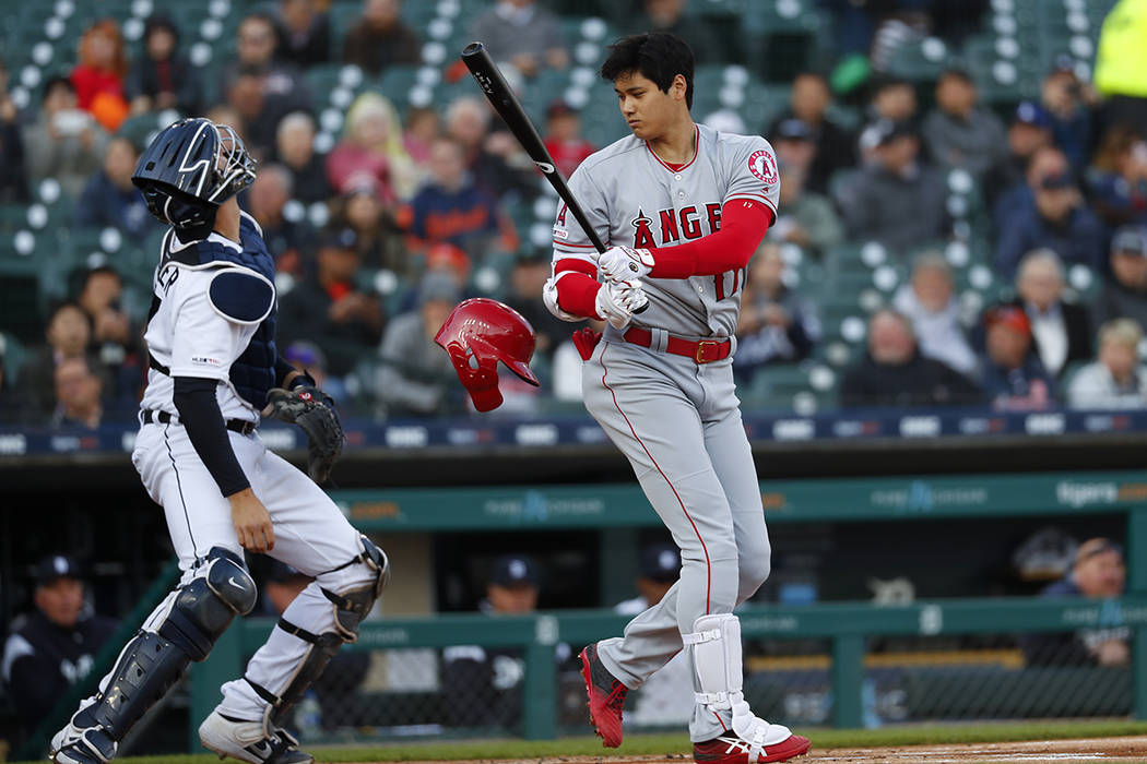 Los Angeles Angels Shohei Ohtani loses his helmet at bat against the Detroit Tigers in the firs ...