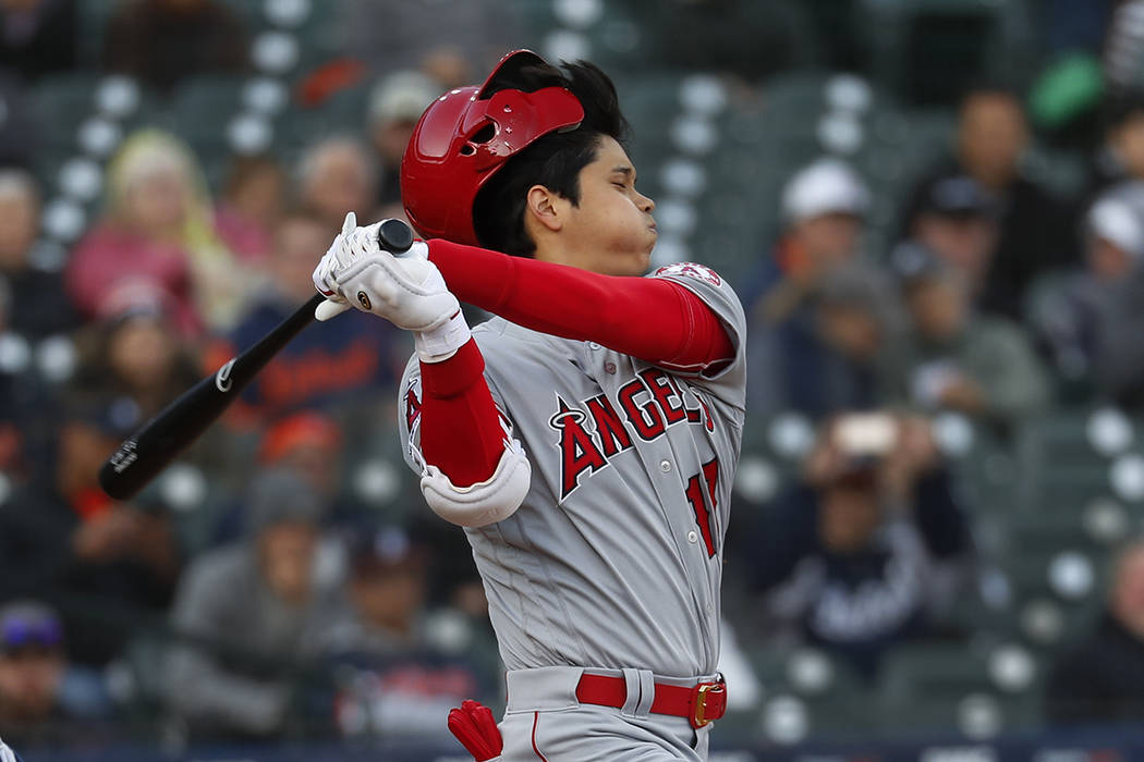 Los Angeles Angels' Shohei Ohtani loses his helmet as he bats against the Detroit Tigers during ...