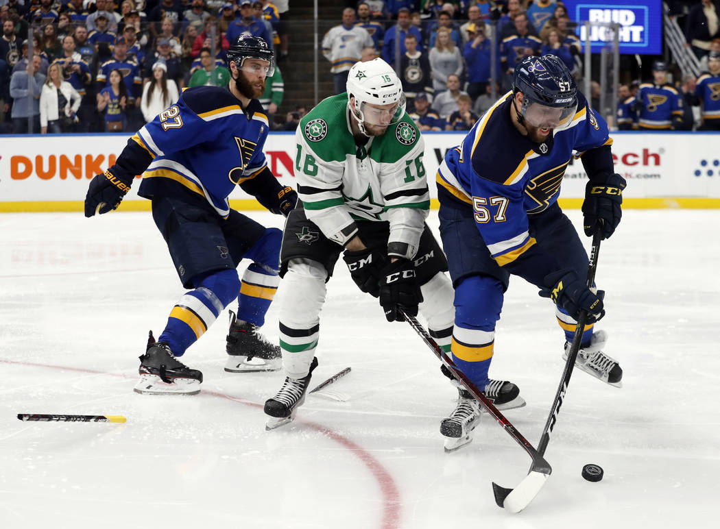 St. Louis Blues' Alex Pietrangelo (27) drops his broken stick as David Perron (57) attempts to ...