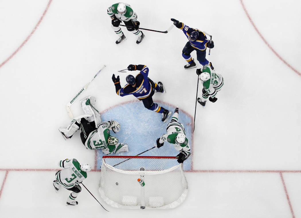St. Louis Blues' Pat Maroon (7) and Robert Thomas (18) celebrate a score by Maroon, as Dallas S ...