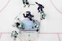 St. Louis Blues' Pat Maroon (7) and Robert Thomas (18) celebrate a score by Maroon, as Dallas S ...