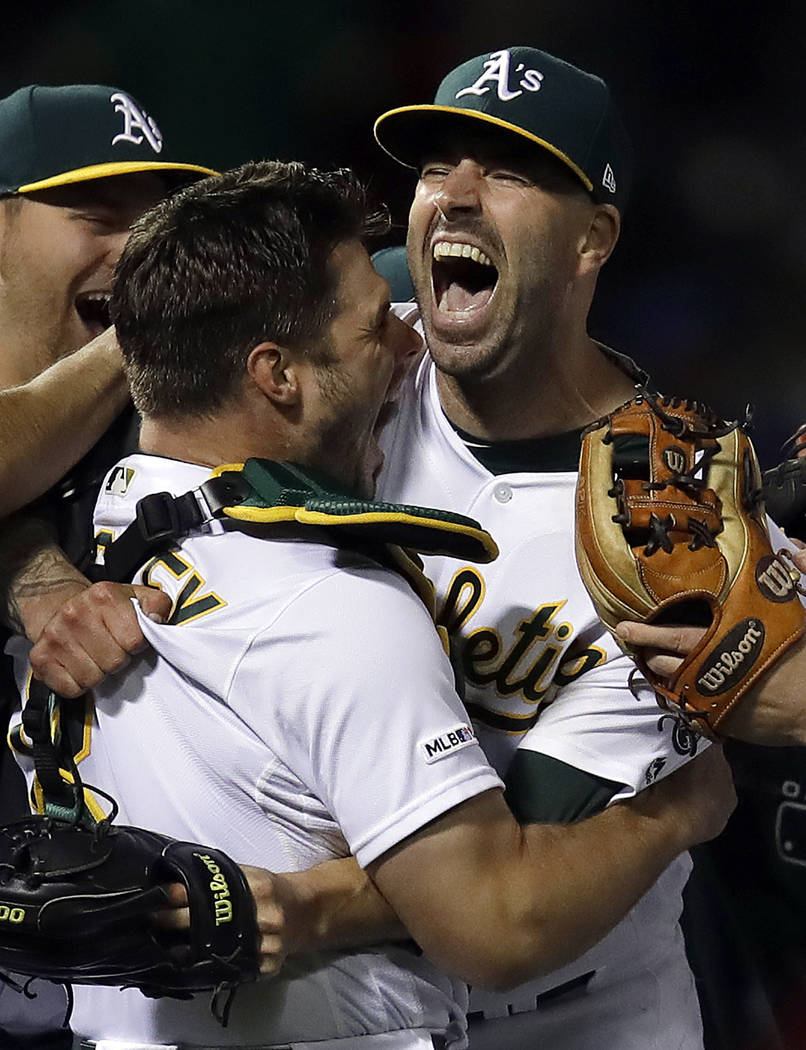 Oakland Athletics' Mike Fiers, right, embraces catcher Josh Phegley after pitching a no hitter ...