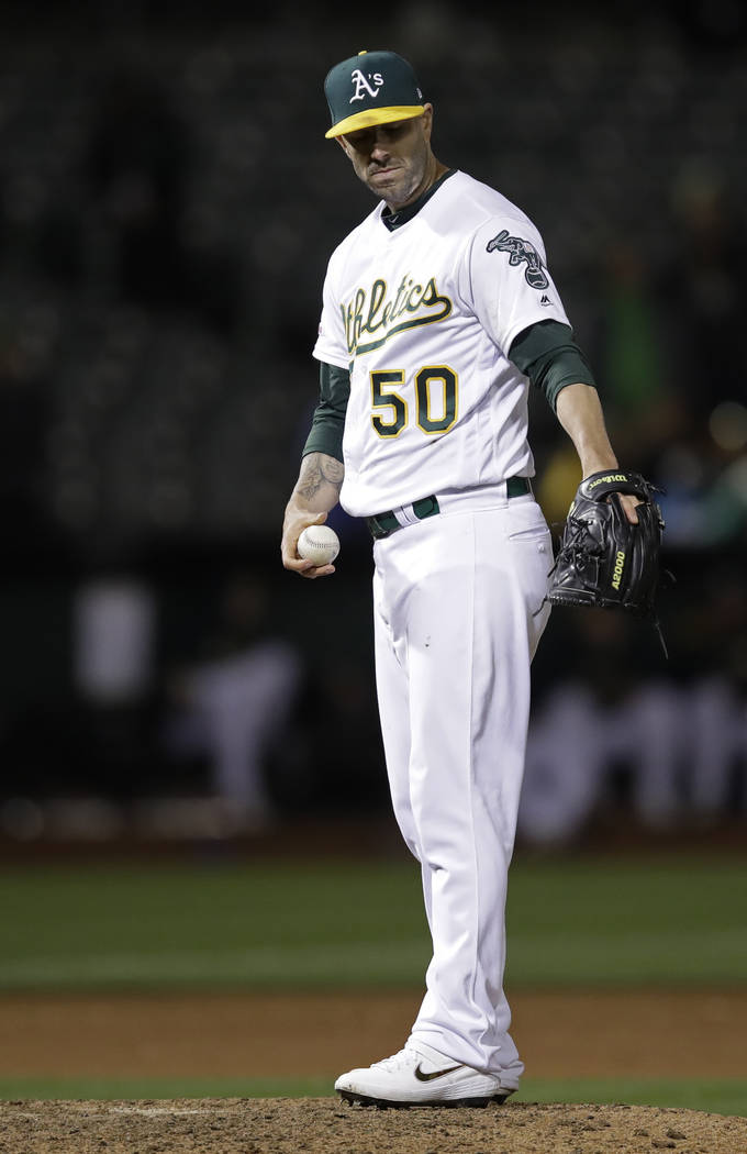 Oakland Athletics' Mike Fiers prepares to pitch against the Cincinnati Reds in the ninth inning ...
