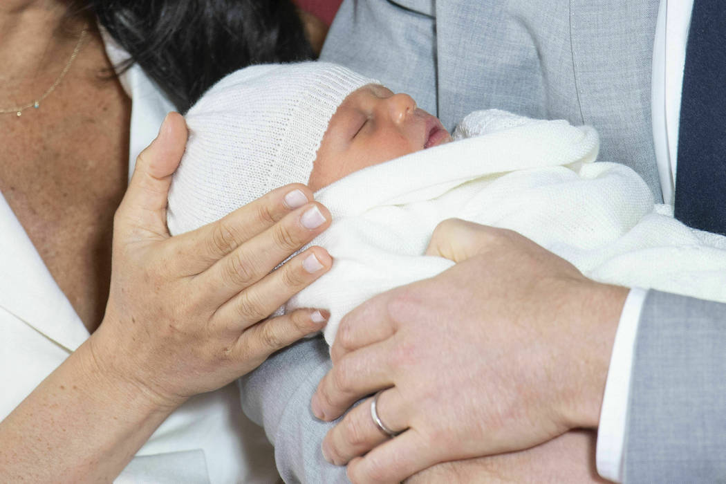 Britain's Prince Harry and Meghan, Duchess of Sussex, during a photo call with their newborn so ...