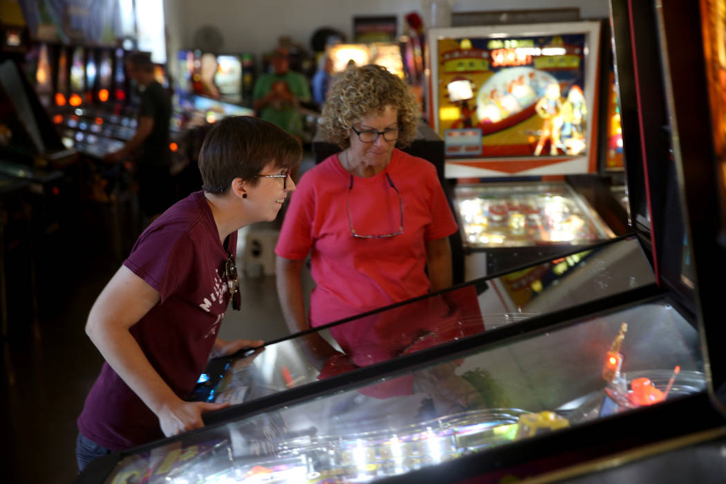 Summer Bradshaw, 28, and her mother LaDean Bradshaw of Kansas City play a pinball machine at th ...