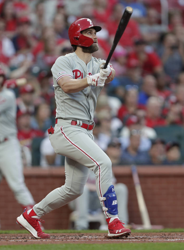 Philadelphia Phillies' Bryce Harper watches his grand slam during the second inning of the team ...