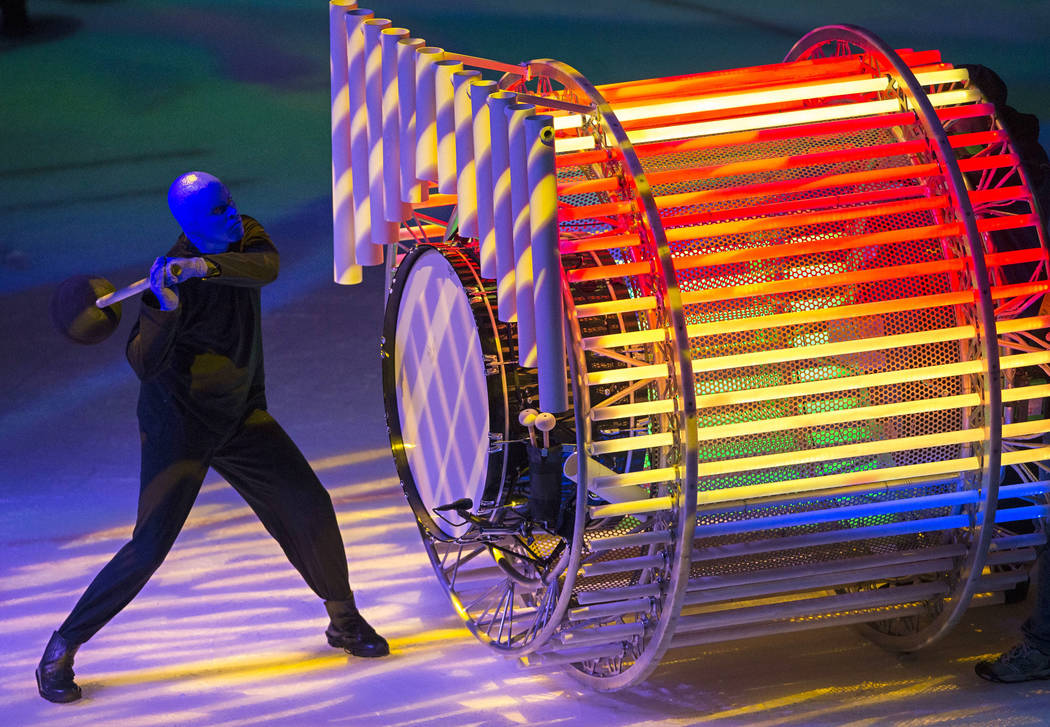 A member of Cirque du Soleil's Blue Man Group performs on the second intermission during an NHL ...