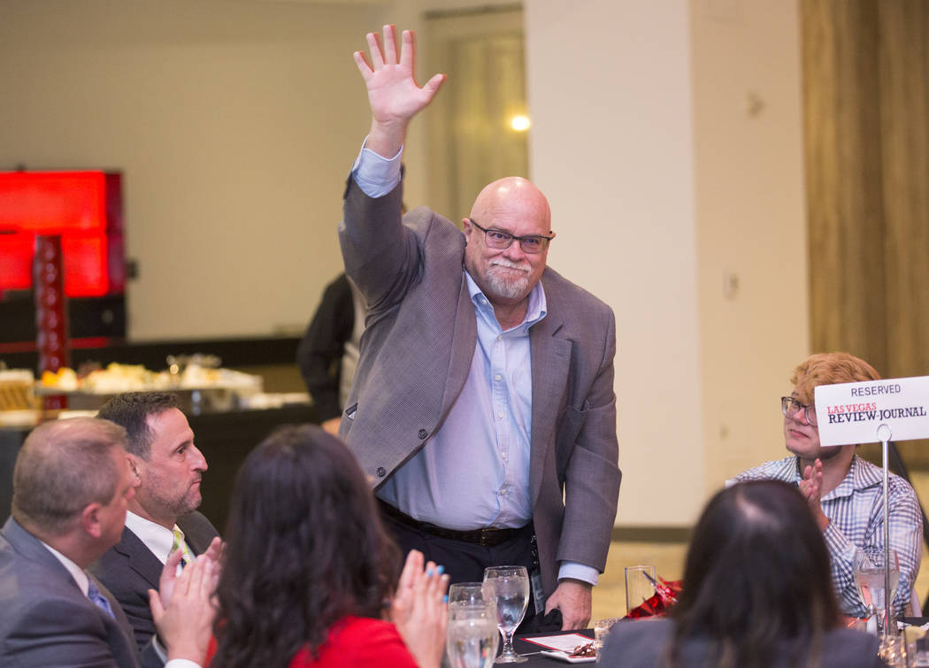 Las Vegas Review-Journal Publisher and Editor Keith Moyer waves to attendees during the Las Veg ...