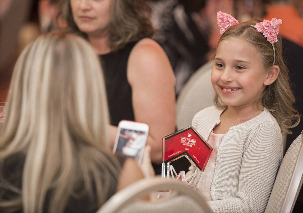 Award winner Rylee Bannister, right, a second grader from Staton Elementary School, gets her ph ...