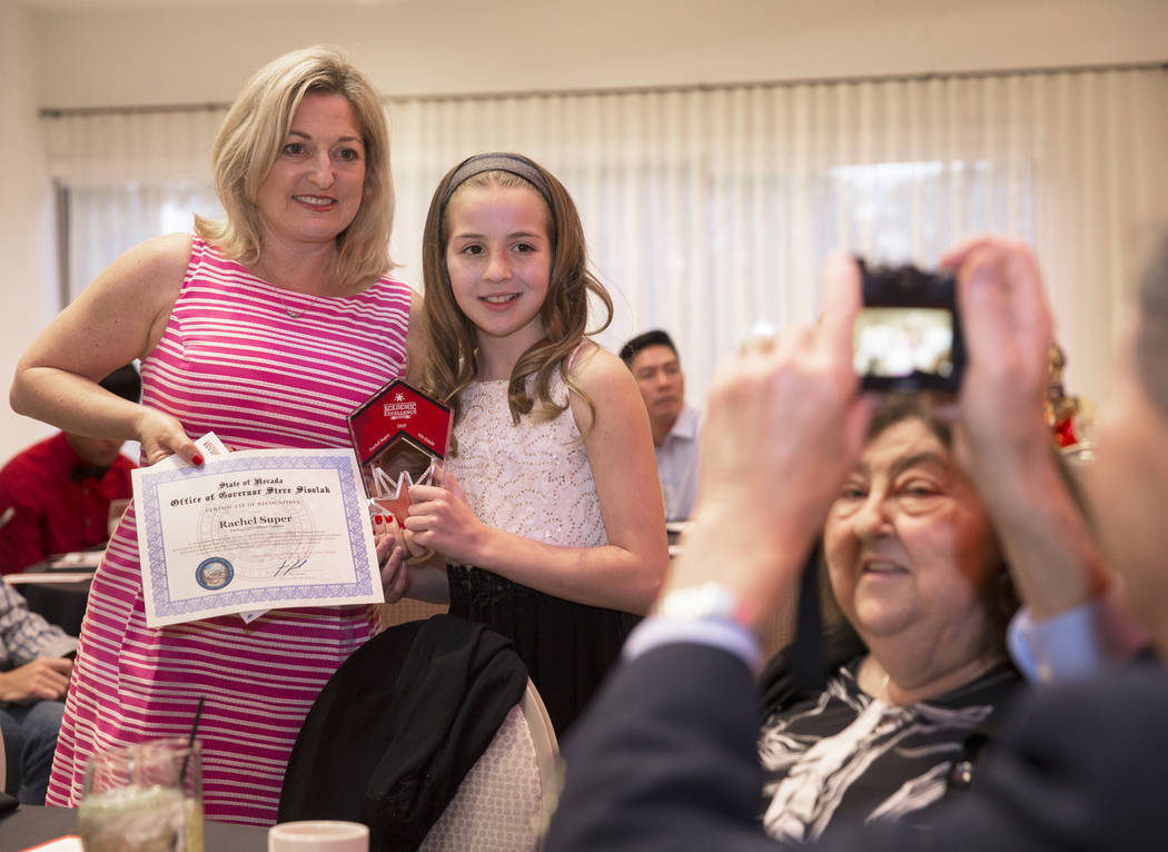 Award winner Rachel Super, second from left, a fifth grader at Adelson Educational Campus, pose ...