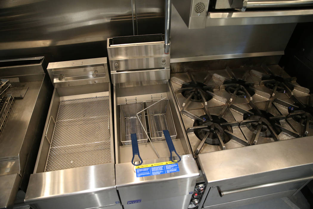 New kitchen appliances in the renovated kitchen at the Shade Tree shelter in North Las Vegas is ...