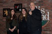 Gary Ellis and his daughters Christina and Annamarie Ellis are shown at "Sing For Strength," a ...