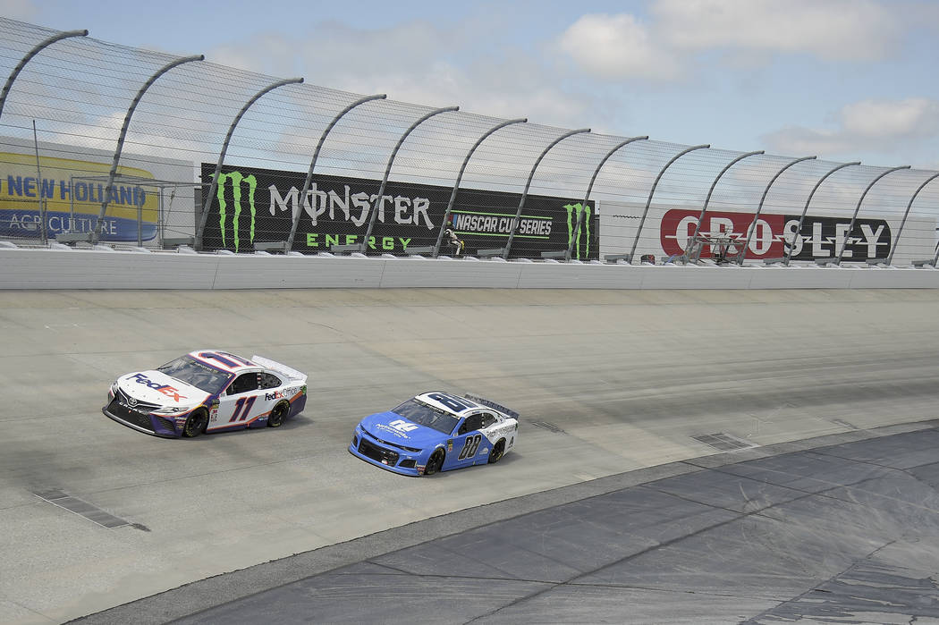 Denny Hamlin (11) leads Alex Bowman (88) during the NASCAR Cup Series auto race, Monday, May 6, ...