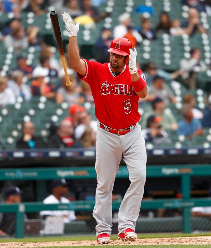 Los Angeles Angels' Albert Pujols tosses his bat after hitting a solo home run in the third inn ...