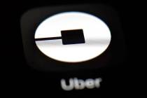 This March 20, 2018, file photo shows the Uber app on an iPad in Baltimore. Uber is about to em ...