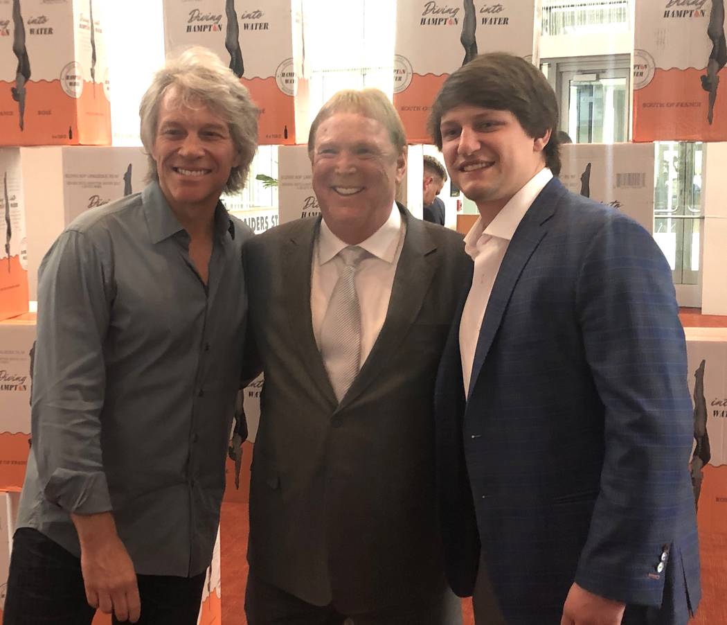 Jon Bon Jovi, Raiders owner Mark Davis; and Bon Jovi's son Jesse Bongiovi are shown at the Clev ...