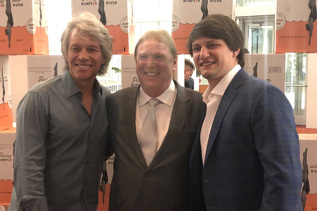 Jon Bon Jovi, Raiders owner Mark Davis; and Bon Jovi's son Jesse Bongiovi are shown at the Clev ...
