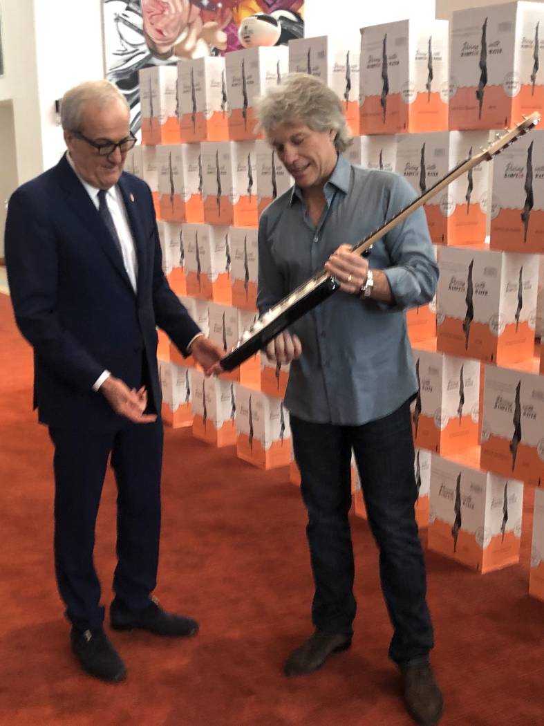 Rock icon Jon Bon Jovi presents a signed guitar to Cleveland Clinic Lou Ruvo Center for Brain H ...