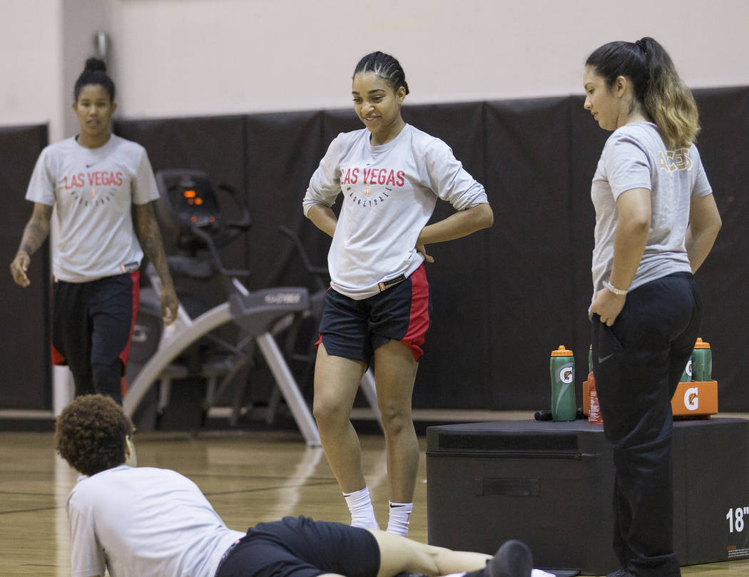 Dominique Wilson, middle, talks with Aces players after practice on Friday, May 10, 2019, at Co ...
