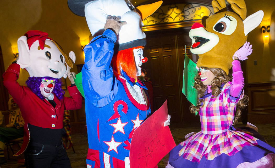 Iliana Mojica, of Costa Rica, left, Hector Batista, center, and Esthefany Perez, both of the Do ...
