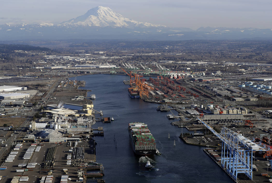 In this March 5, 2019 photo, a cargo ship arrives at the Port of Tacoma, in Tacoma, Wash. U.S. ...