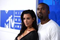 In this Aug. 28, 2016 file photo, Kim Kardashian West, left, and Kanye West arrive at the MTV V ...