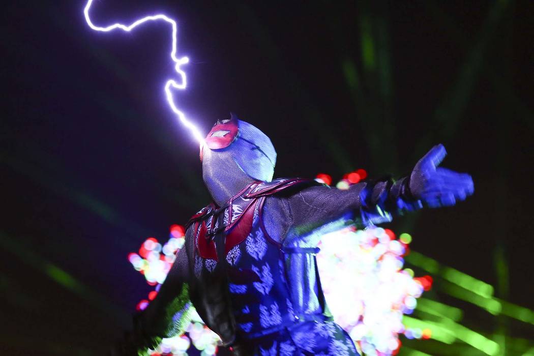 A member of SkyFire Arts performs during the third day of the Electric Daisy Carnival at the La ...