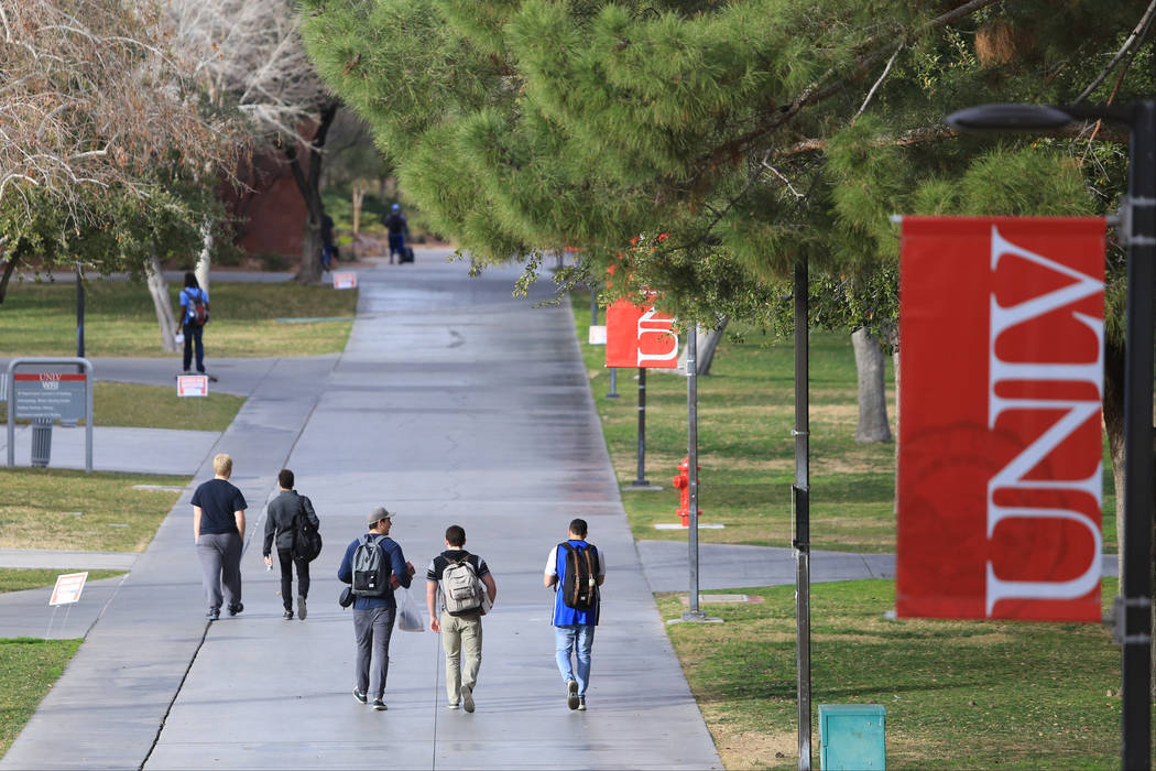 Students walk along a sidewalk at UNLV in 2017 in Las Vegas. (Las Vegas Review-Journal)