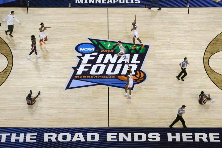 Virginia players celebrate after defeating Auburn 63-62 in the semifinals of the Final Four NCA ...