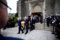 Pallbearers carry the casket of NHL legend Leonard Patrick "Red" Kelly after a funera ...