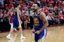 Golden State Warriors guard Stephen Curry (30) celebrates the team's win over the Houston Rocke ...