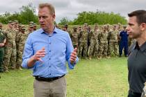 Acting Defense Secretary Patrick Shanahan, left, speaks with troops near McAllen, Texas, about ...
