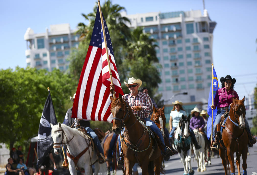 Rafael Sarabia, center, of Sin City Riders, participates in the Helldorado Parade along Fourth ...