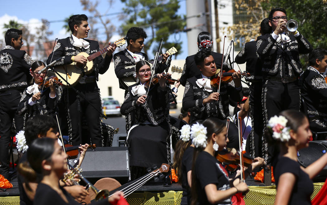 Members of Mariachi Encendido of Del Sol Academy perform during the Helldorado Parade along Fou ...