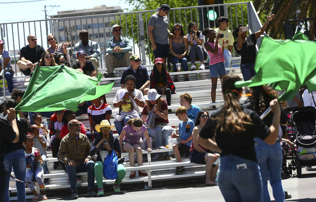 Attendees watch performers from Mojave High School during the Helldorado Parade along Fourth St ...