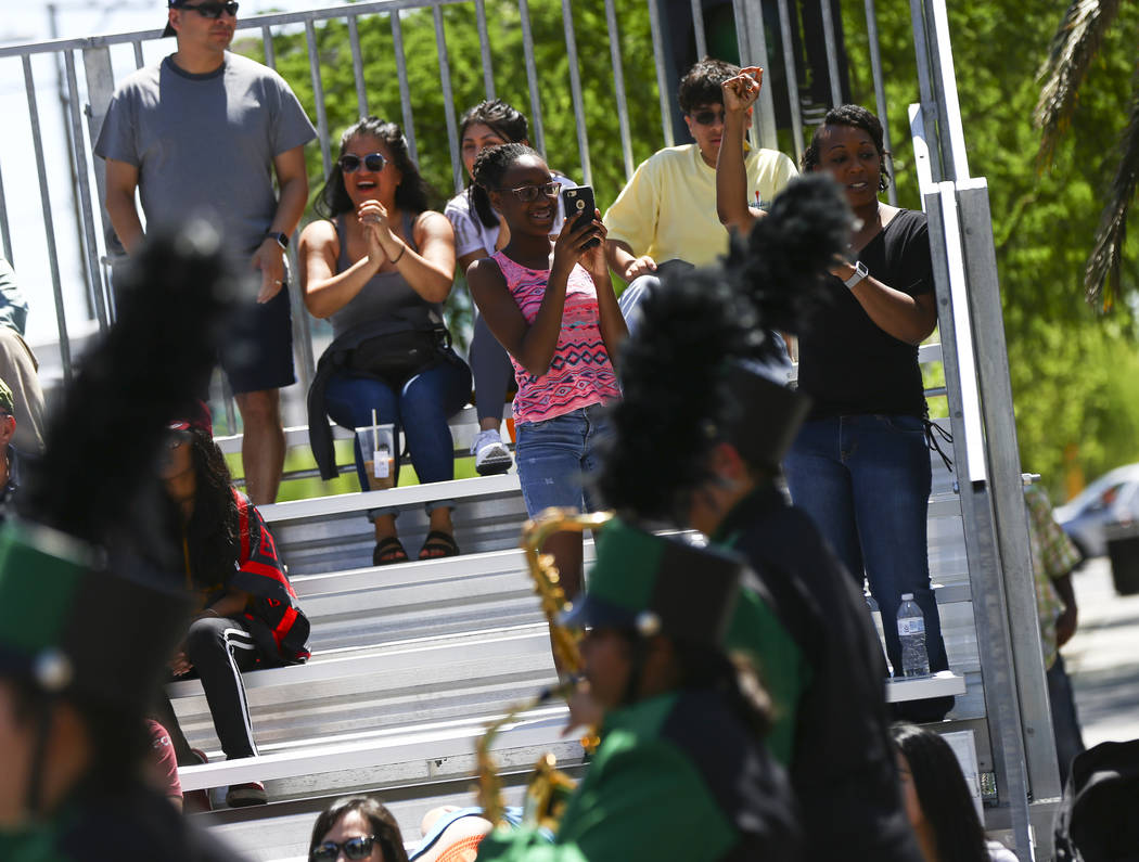 Attendees watch performers from Mojave High School during the Helldorado Parade along Fourth St ...