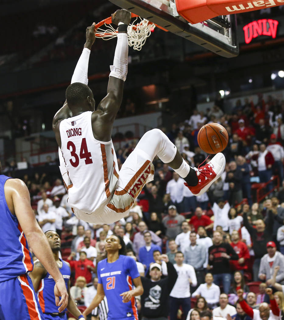 UNLV Rebels forward Cheikh Mbacke Diong (34) dunks against Boise State during overtime in a bas ...
