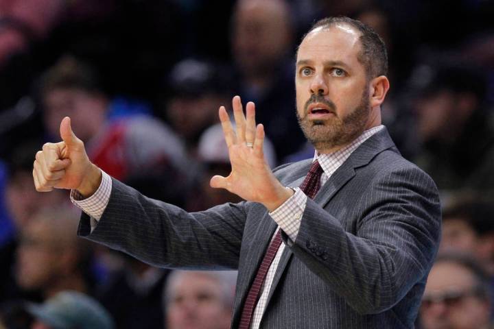 Orlando Magic coach Frank Vogel signals from the sideline during the team's game against the Ph ...