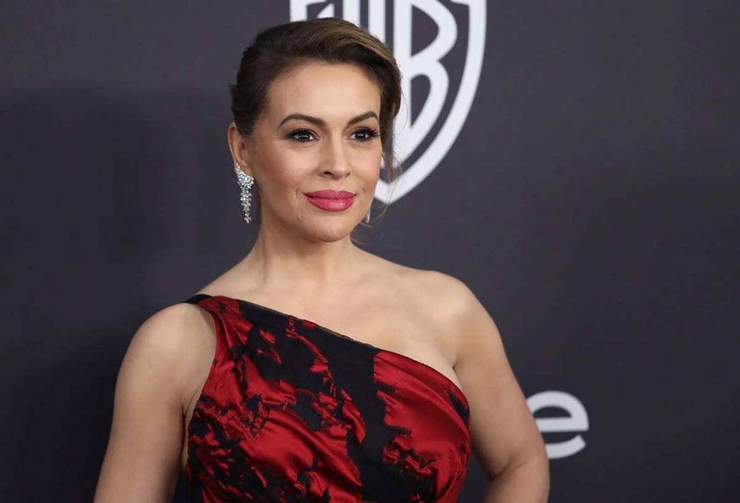 In this Jan. 6, 2019 file photo, Alyssa Milano arrives at the InStyle and Warner Bros. Golden G ...