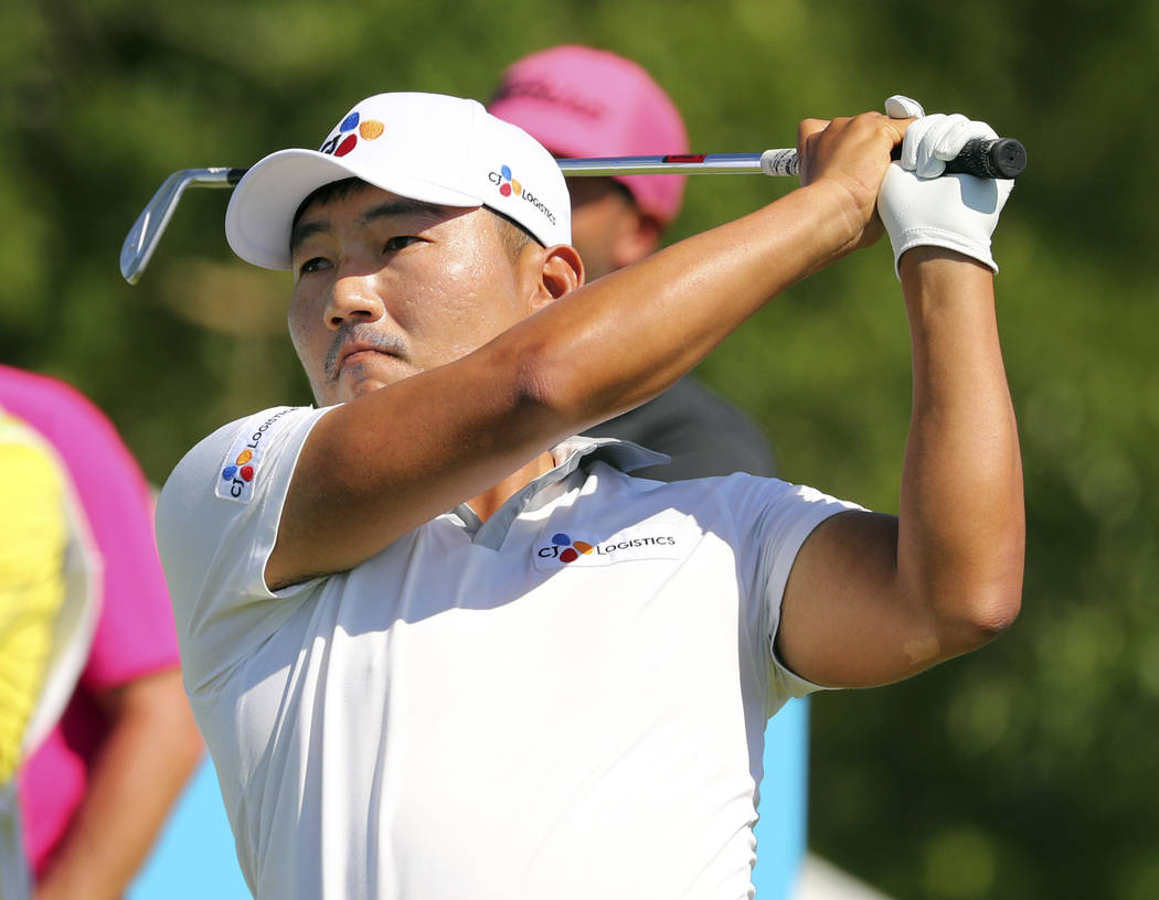 Sung Kang watches his shot off the 12th tee In the final round of the Byron Nelson golf tournam ...