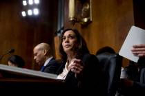 Sen. Cory Booker, D-N.J., left, and Sen. Kamala Harris, D-Calif., center, listen as Attorney Ge ...