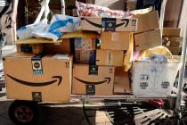 In this Oct. 10, 2018, file photo Amazon Prime boxes are loaded on a cart for delivery in New Y ...