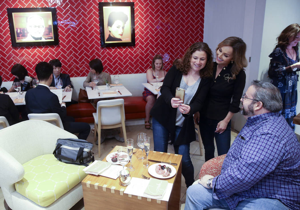 Giada De Laurentiis, center, visits with Jodie and Mark Silberman of Chicago at the start of Ap ...